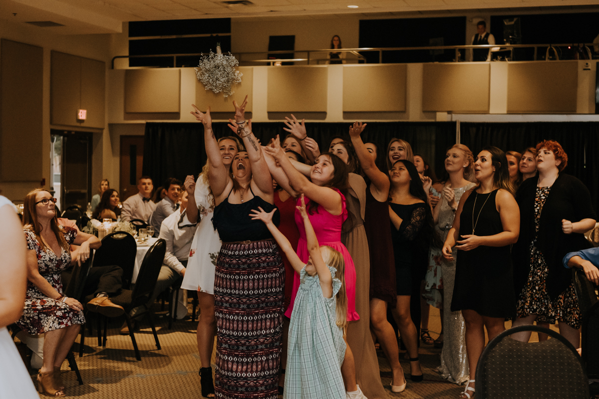 bouquet toss | Tampa wedding | Emily + Aaron | Freehearted Film Co | Tampa Wedding Photography and Wedding Videography